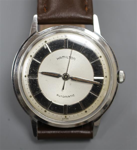 A gentlemans 1960s stainless steel Hamilton automatic wrist watch, with baton numerals and later associated leather strap,